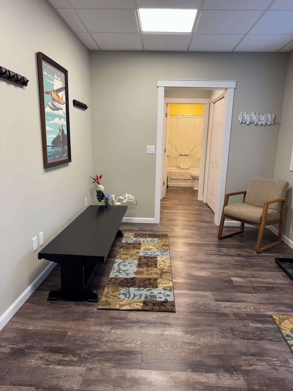 Entry, looking to the right of the door, toward laundry and bathroom.