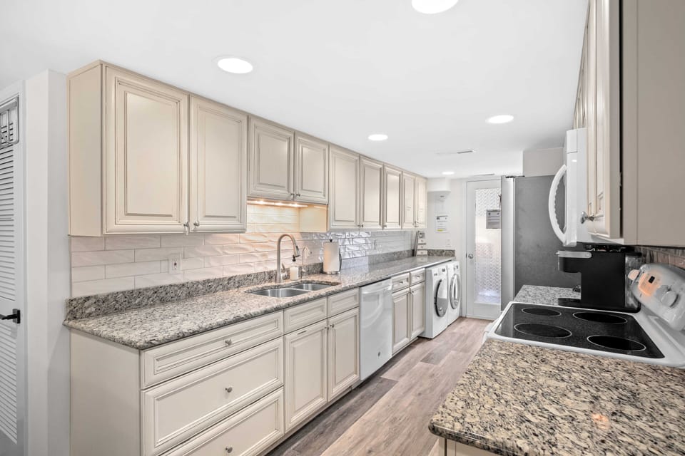 Spacious and fully stocked kitchen.