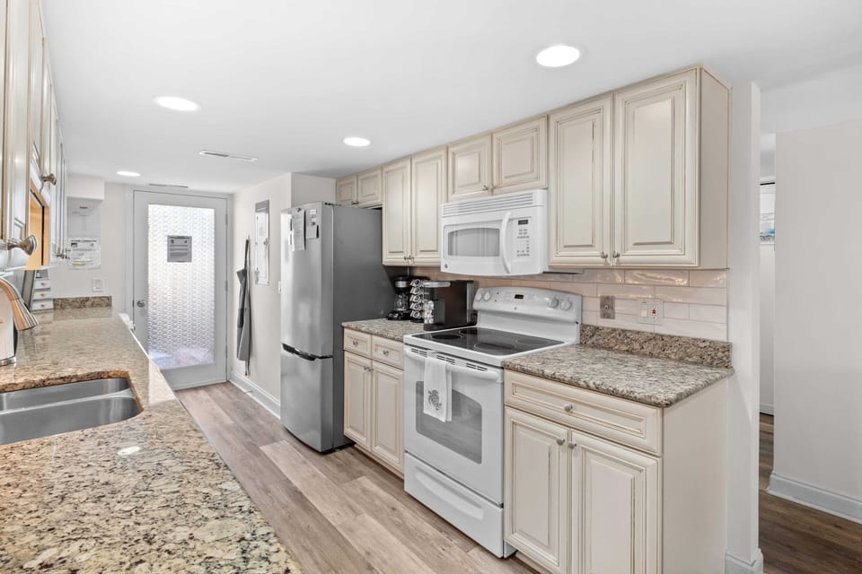 Spacious and fully stocked kitchen.
