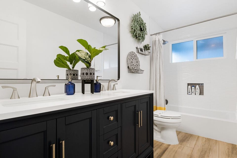 Newly renovated bathroom with double sinks.