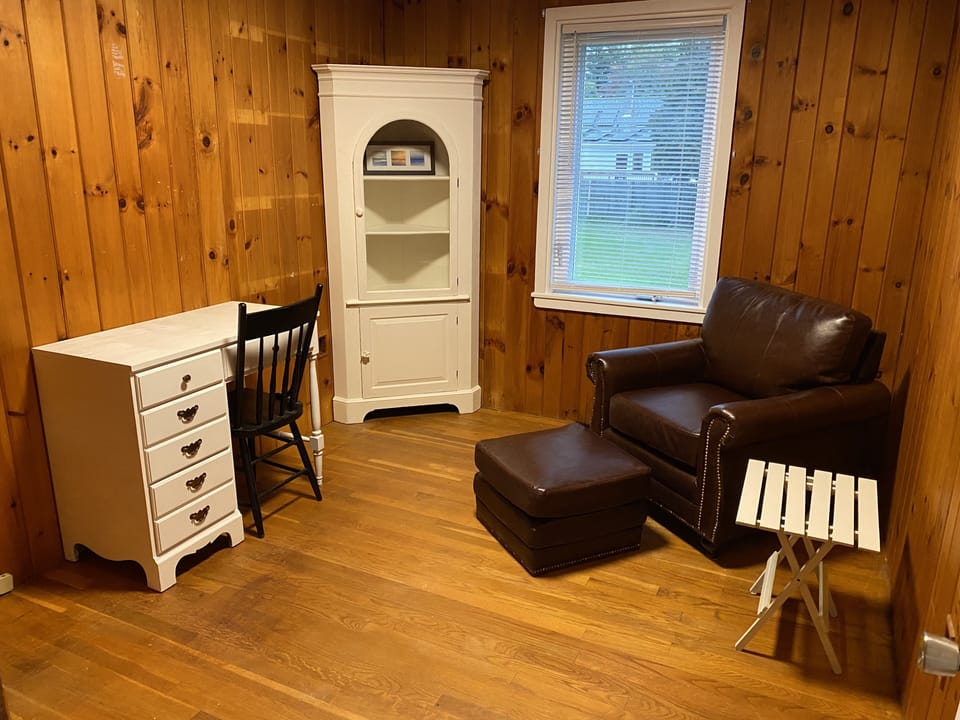 Office with desk and comfy faux leather chair 