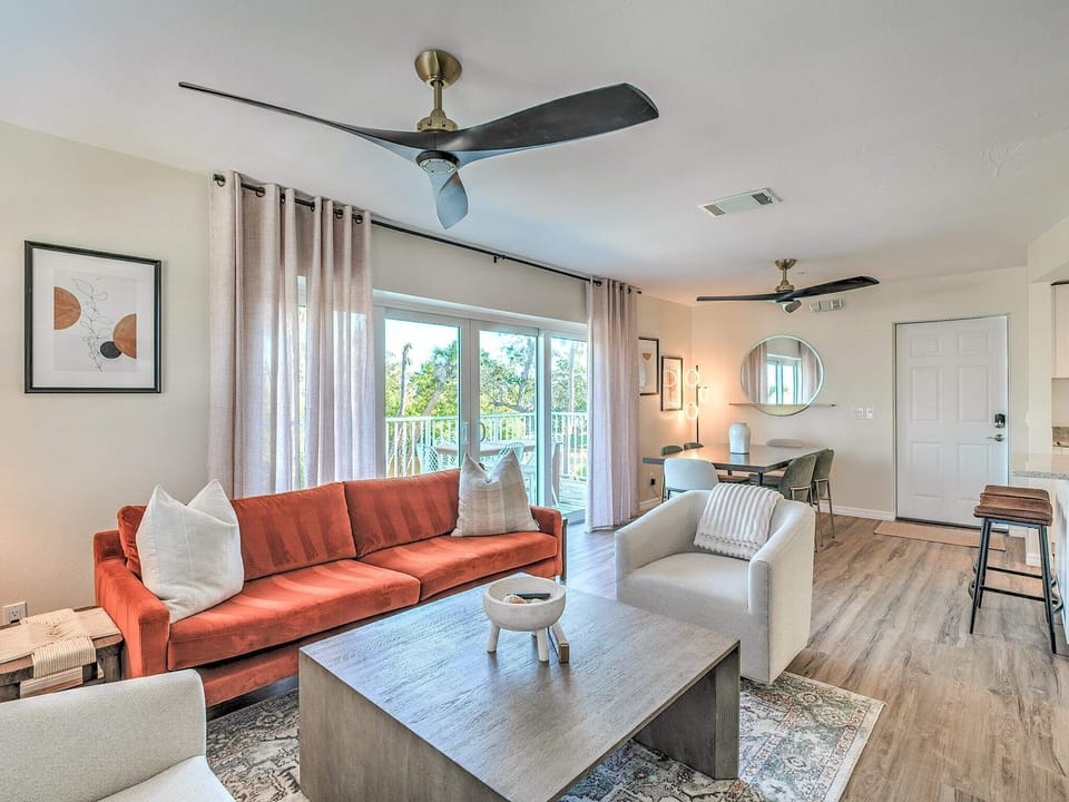 Living and Dining Spaces with Large, 4-Panel Patio Door to Deck