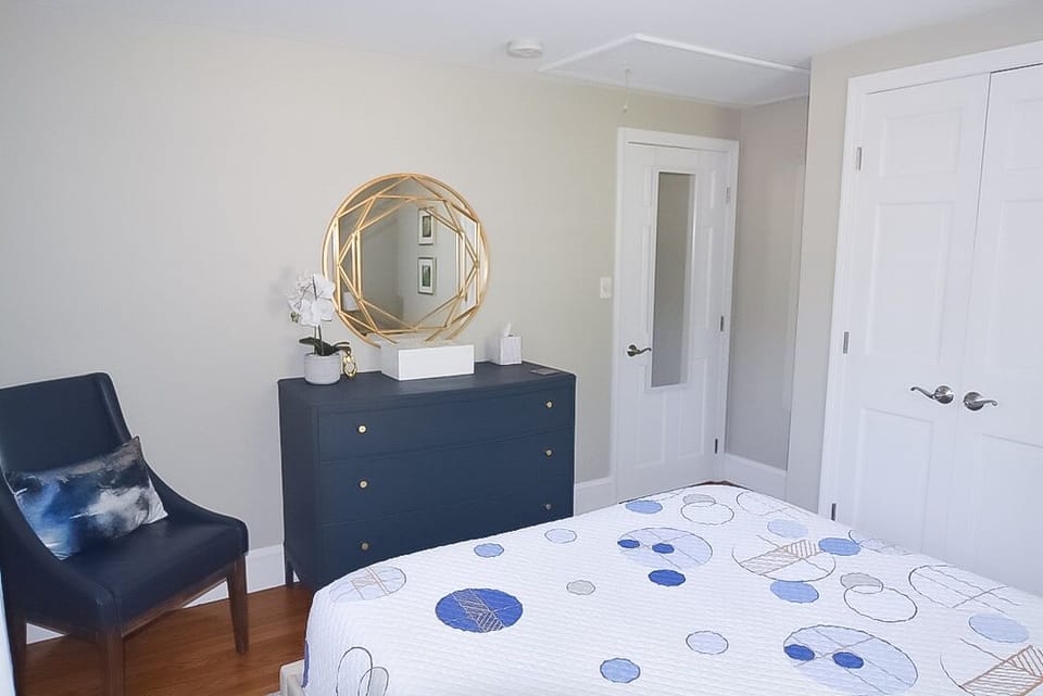 smaller of the two bedrooms, full length mirror