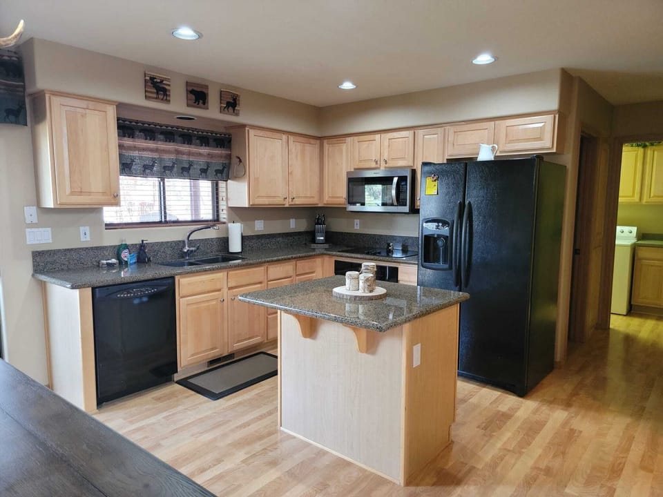 A Kitchen with enough space to make food for all the animals.