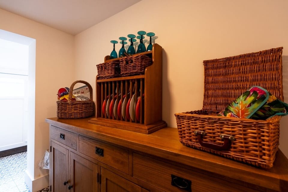 Utility room with washing machine and tumble dryer.