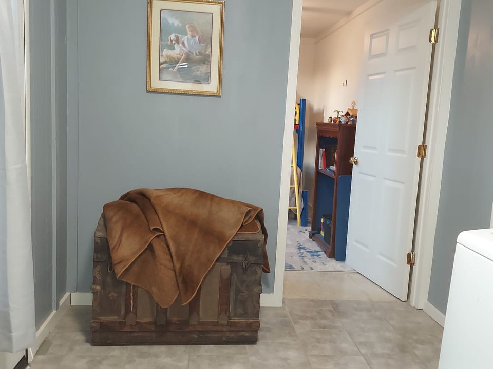 The third bedroom is located off of the utility room. 