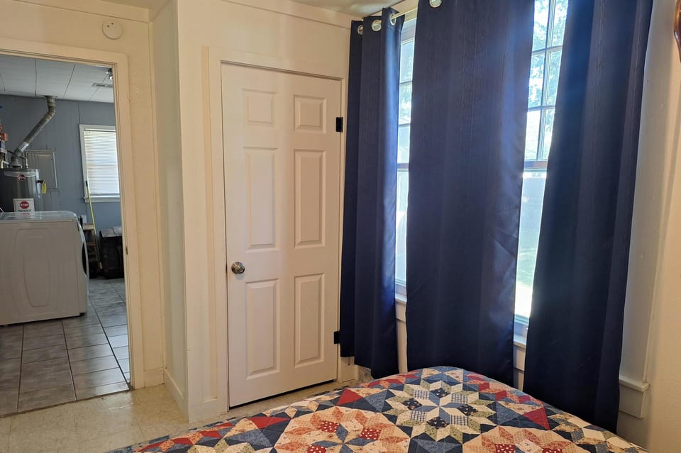 The third bedroom is located off of the utility room. 