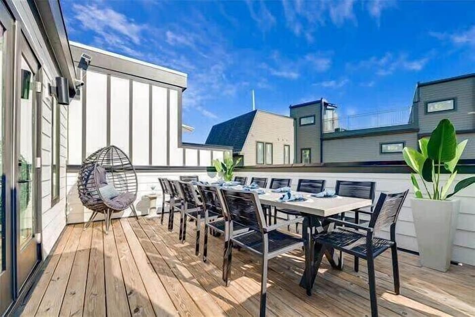 Roof deck with grill, lounge chair and large dining table