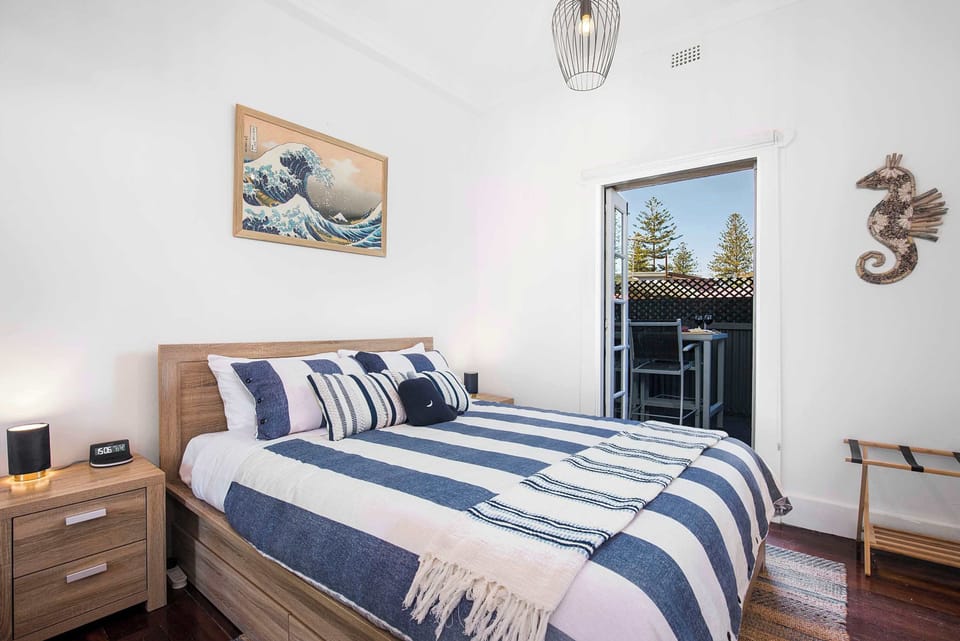 Main bedroom, with french doors leading out to deck