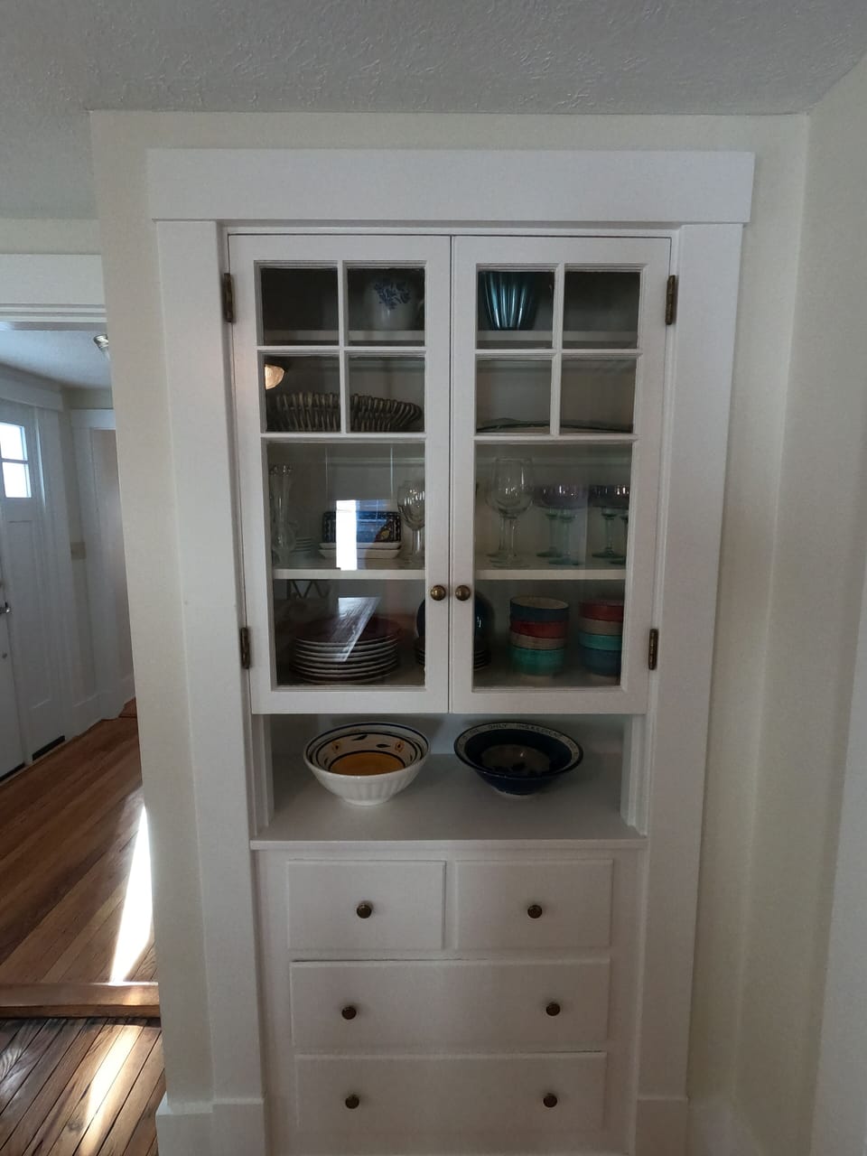 Large built-in cabinet in the dining room for dishes and glasses!