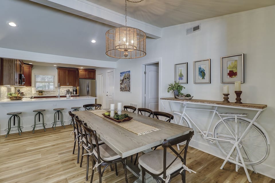 Dining area seats ten comfortably with additional five bar stools.