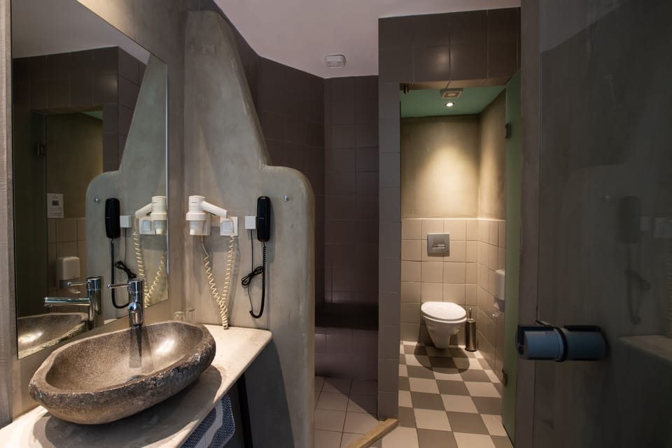 Junior Suite, 1 Bedroom (Single Use) | Bathroom | Hair dryer, towels