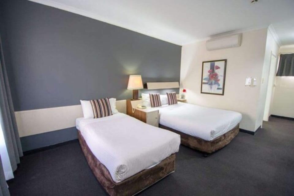 Standard Twin Room | Blackout drapes, iron/ironing board, free WiFi, bed sheets