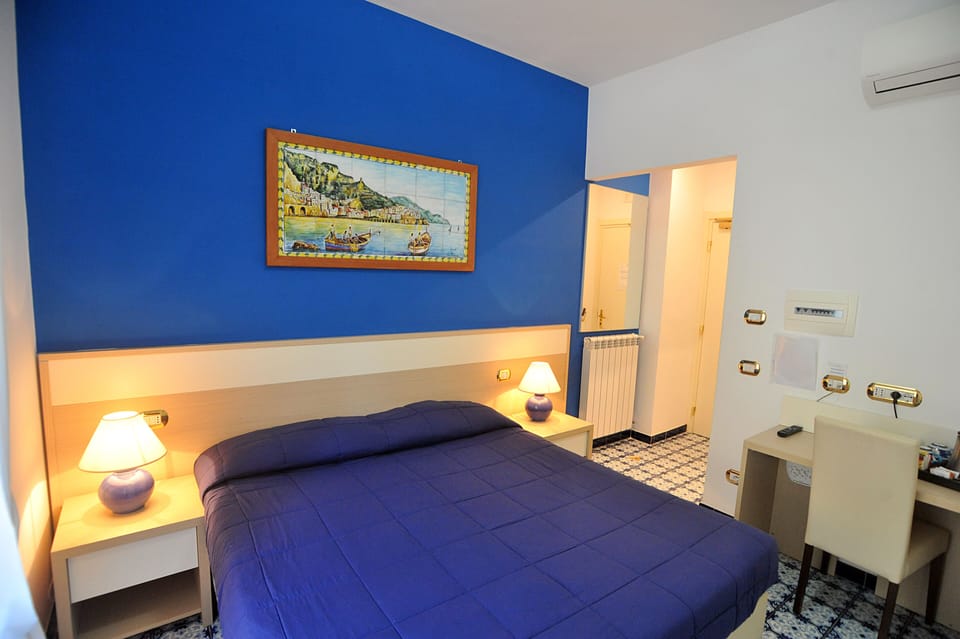 Triple Room | Minibar, in-room safe, individually furnished, desk