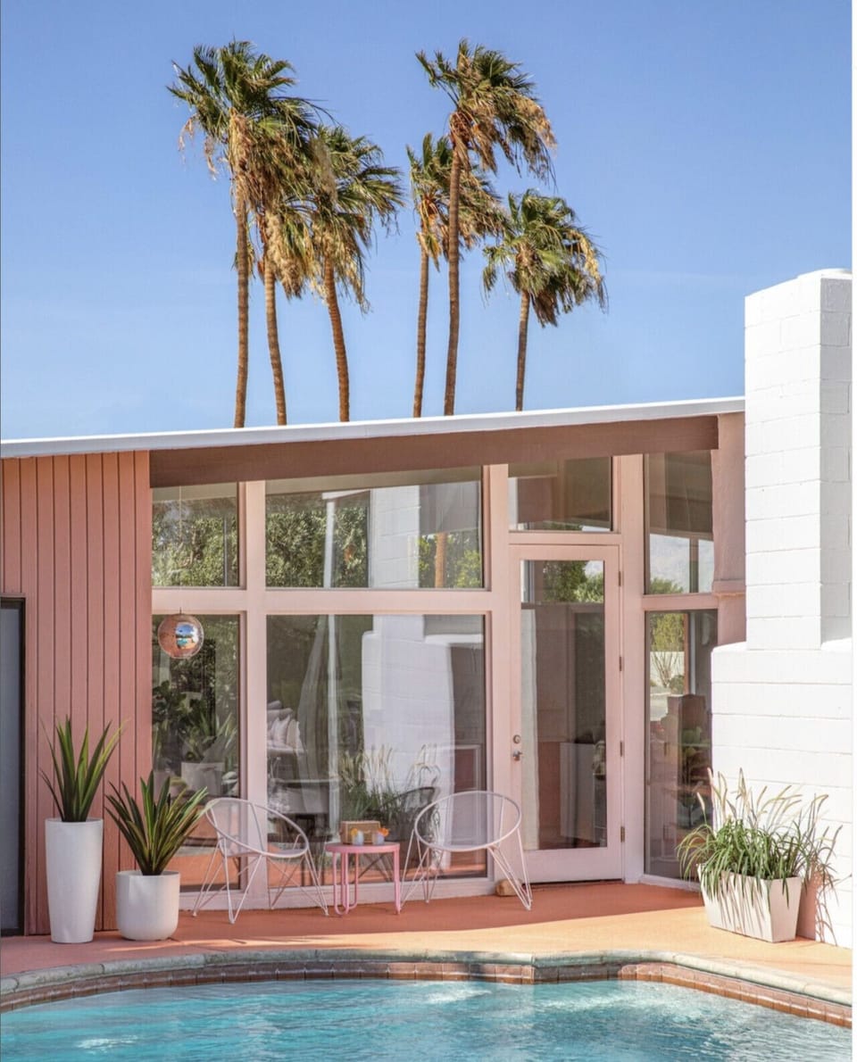 Mid-century modern vibes meet poolside paradise 🌴☀️ Lounge on the patio, take a dip, and soak in the palm tree views at this dreamy desert escape. #PoolsidePerfection #DesignGoals #DesertVibes