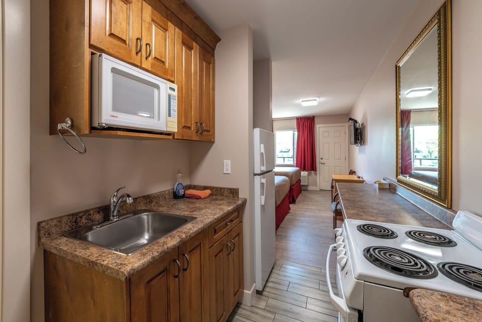 Deluxe Room, 2 Queen Beds | Private kitchen | Microwave, coffee/tea maker