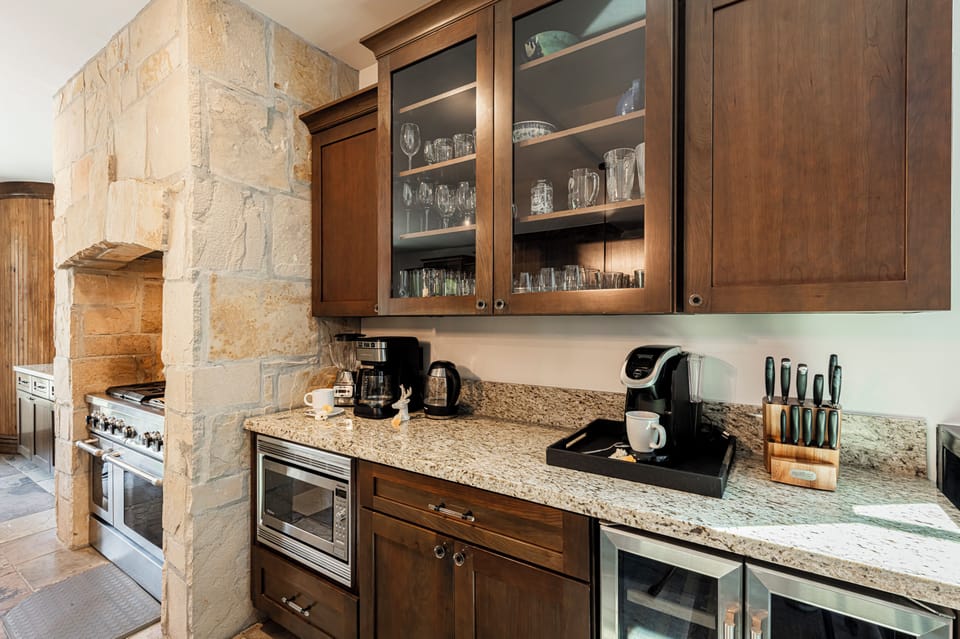Beverage bar with coffee makers and a wine fridge