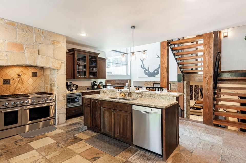 Spacious kitchen with high-end stainless steel appliances