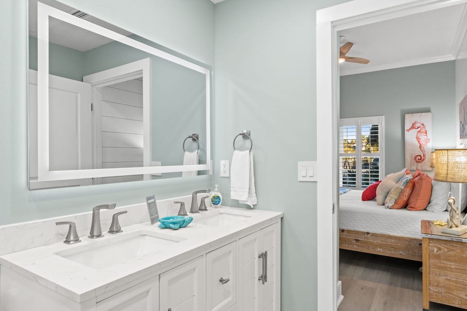 Bright Coastal Master Bath with LED-Lit Mirrors and Spa Feel
