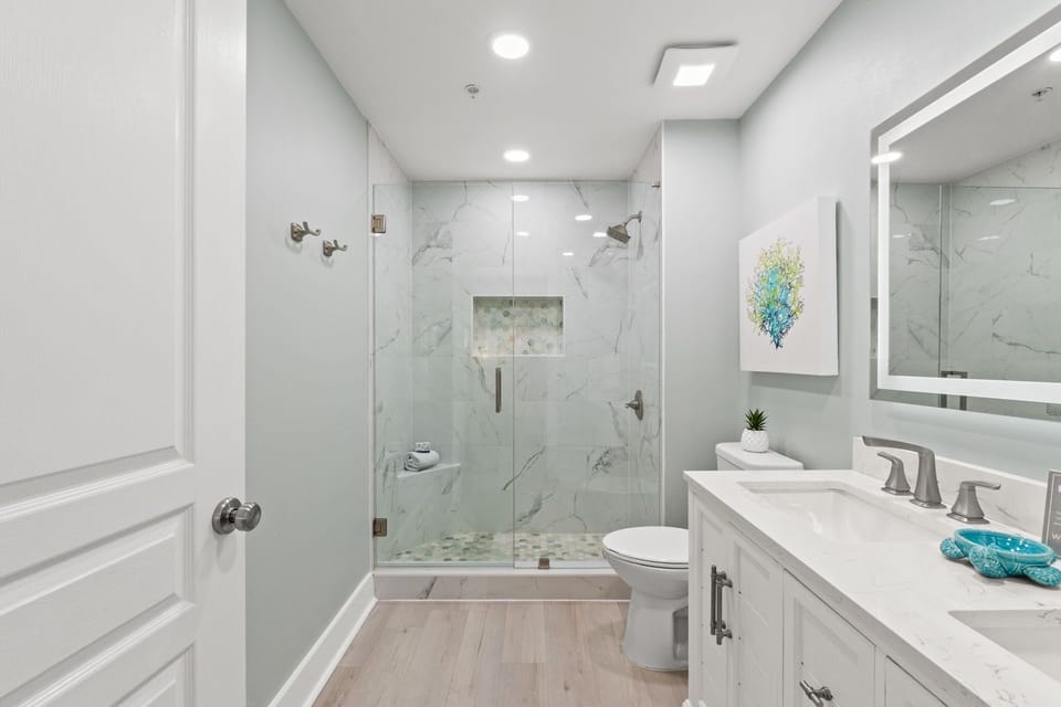 Spa-Style Master Bath with Lighted Mirrors and Coastal Touches' 