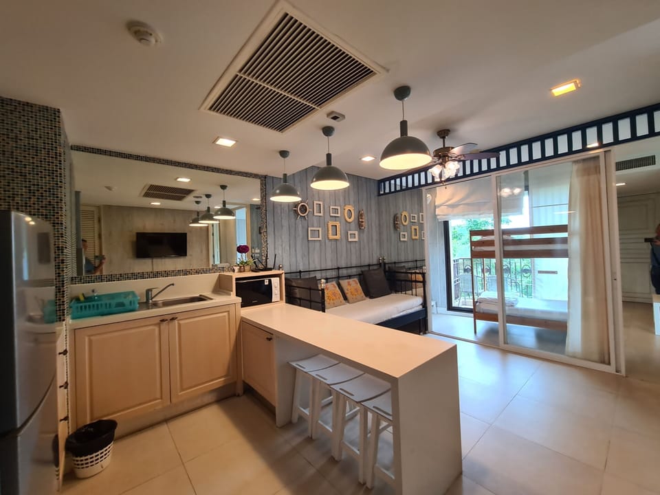 Family Condo, 1 Bedroom, Garden View | Living area | 40-inch flat-screen TV with digital channels, TV