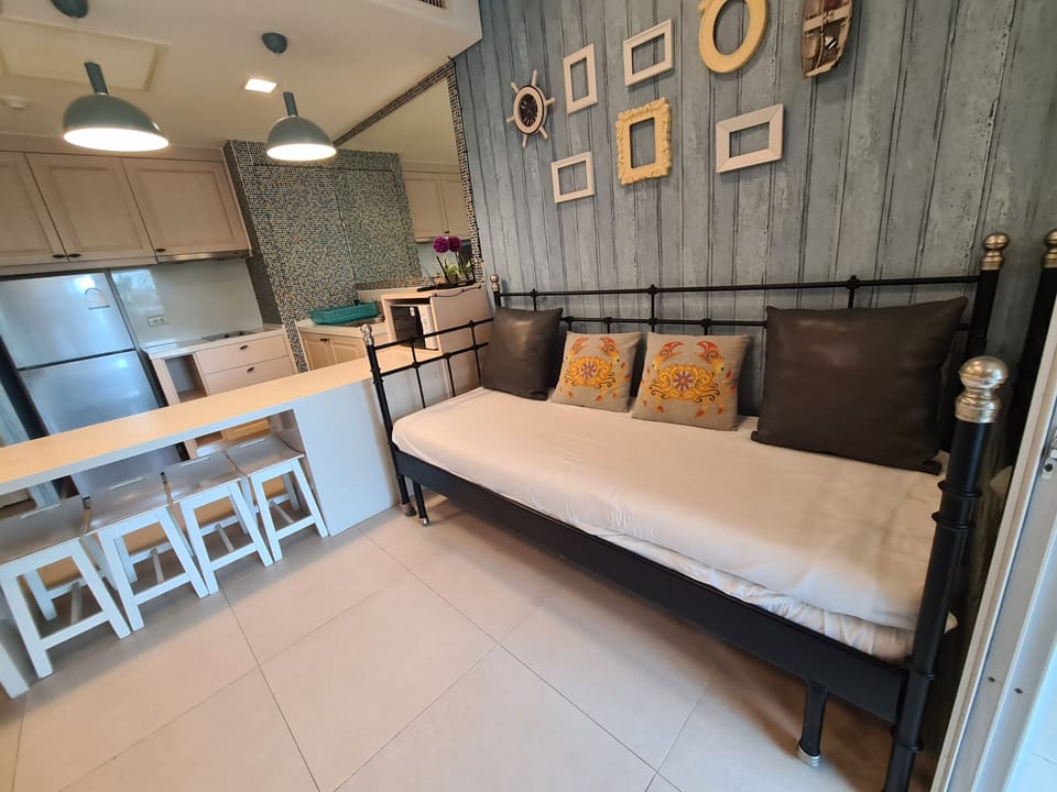 Family Condo, 1 Bedroom, Garden View | Living area | 40-inch flat-screen TV with digital channels, TV