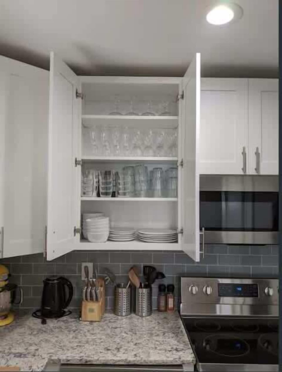 The kitchen is stocked with glasses and dishes for your stay.