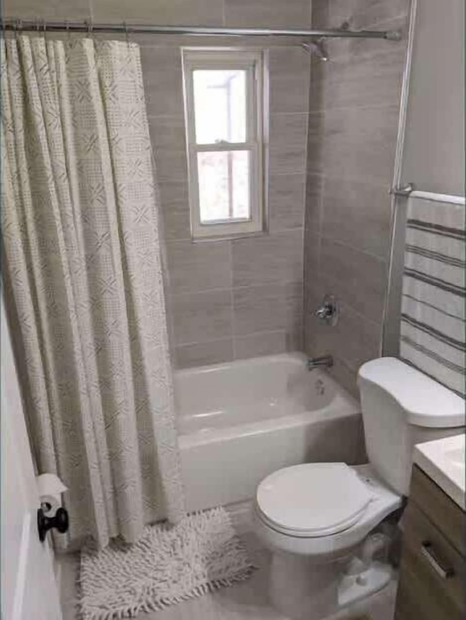 The bathroom come complete with a shower/tub combination and basic amenities. 