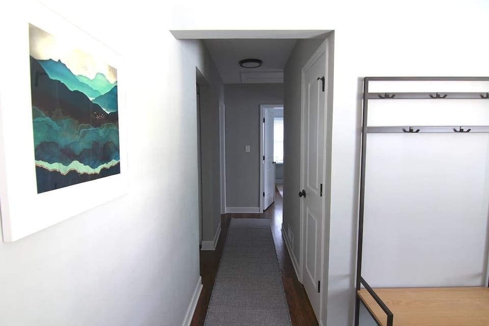 Hallway leading to the three bedrooms and bathroom 