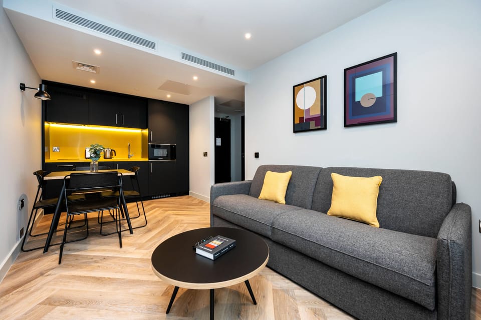1 Bedroom Apartment | Living area | Flat-screen TV