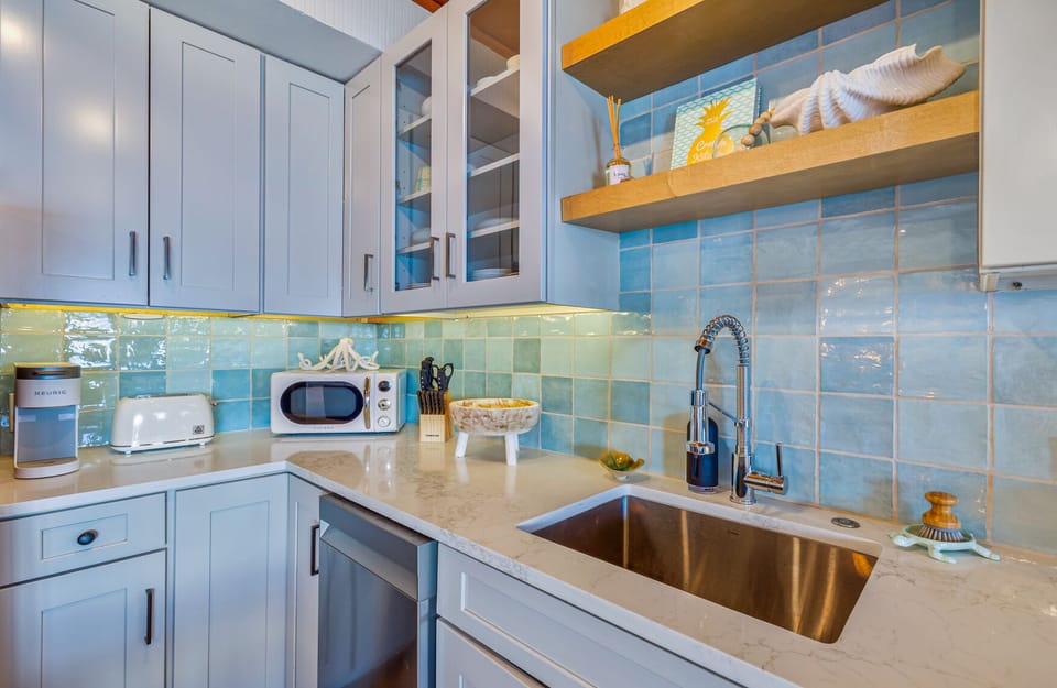 Cook, sip, and unwind in your fully equipped kitchen with ocean ambiance
