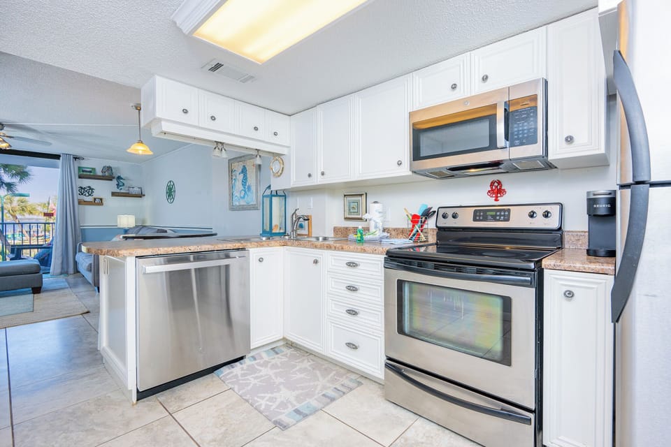 Craft delicious meals and enjoy quality family time as you gather in this inviting kitchen filled with coastal charm
