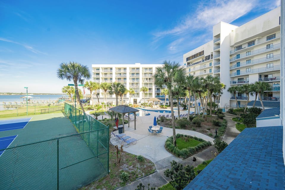 Relax on your balcony as you soak in the vibrant coastal views and enjoy the serene poolside vibes below