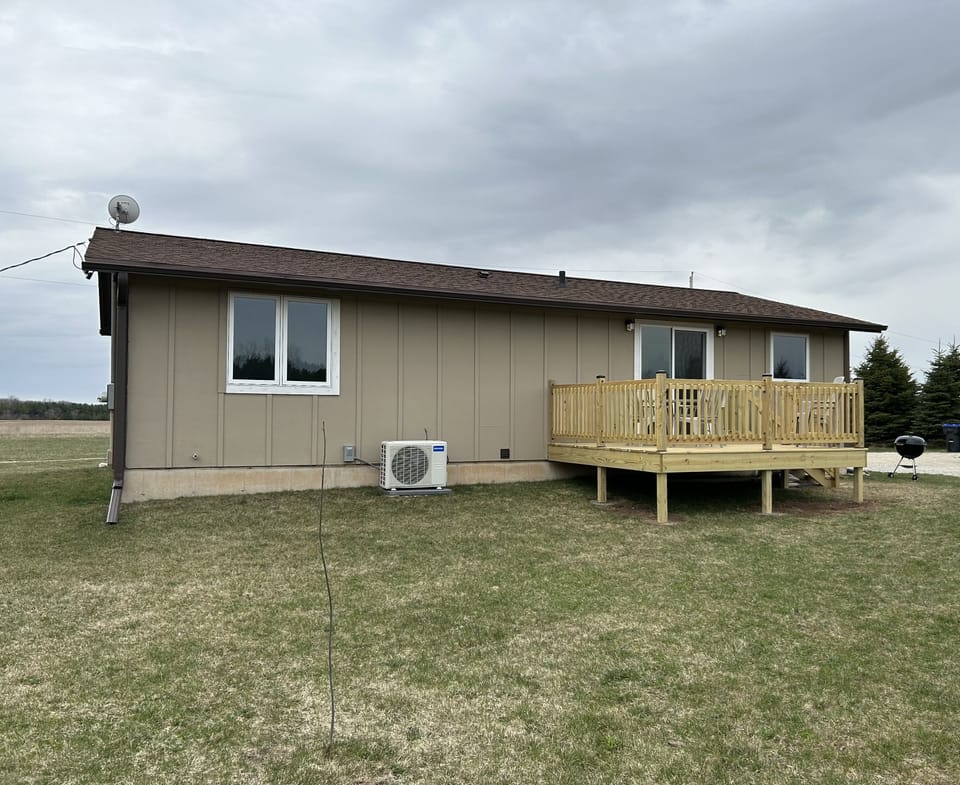 Back of the house with a new deck 