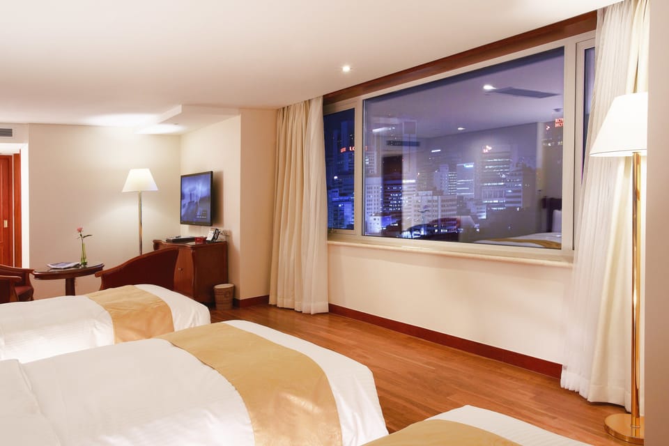Deluxe Triple Room | Premium bedding, down comforters, in-room safe, laptop workspace