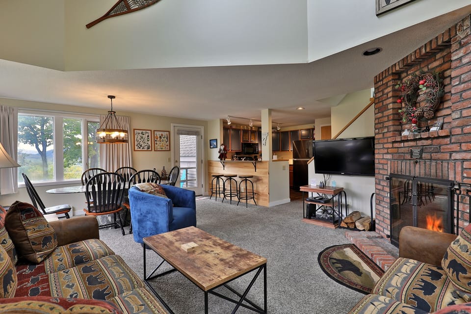 Cozy open floor plan layout and wood burning fireplace