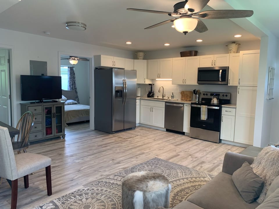 The home has a full kitchen, stocked with appliances and cookware.