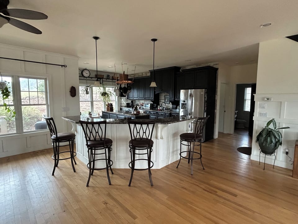 Spacious well equipped kitchen with large raised island with bar seating for 4.