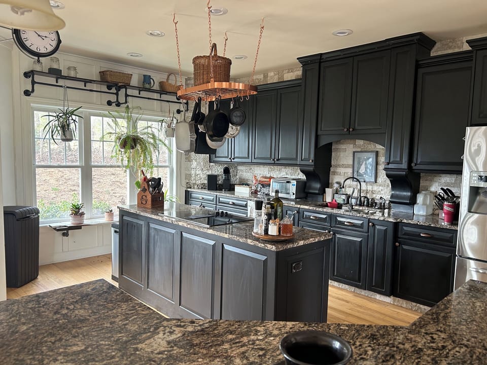Spacious well equipped kitchen with cooking island.