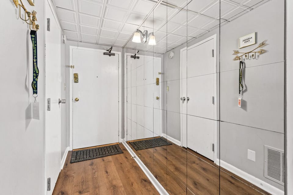 Entrance to the condo with a wall of mirrors!
