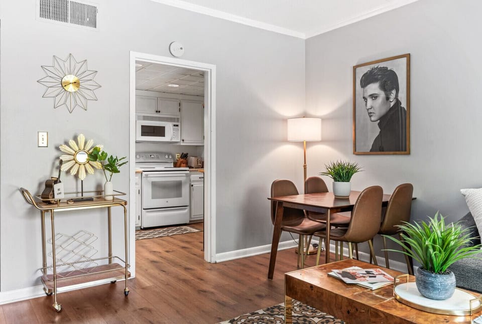 Bright and spacious living room off the kitchen. Smart TV, room darkening shades, and pull-out sleeper sofa for ultimate comfort + Dining table that can seat 4 people!
