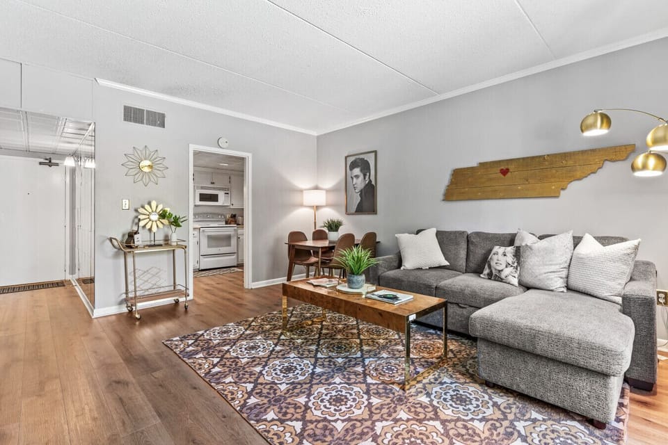 Bright and spacious living room off the kitchen. Smart TV, room darkening shades, and pull-out sleeper sofa for ultimate comfort + Dining table that can seat 4 people!