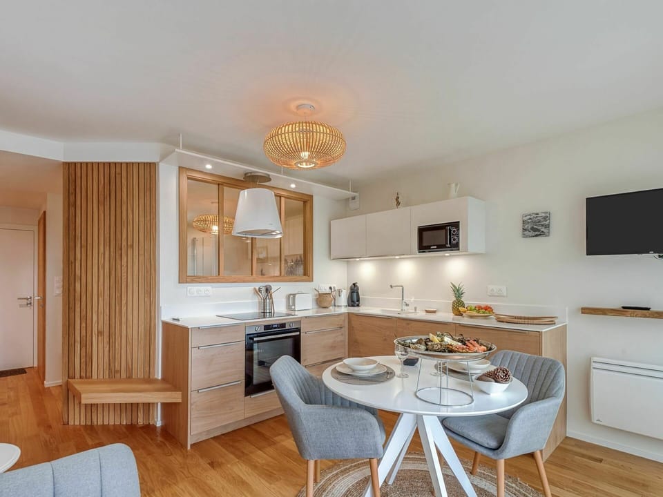 Table, Furniture, Property, Countertop, Cabinetry, Wood, Living Room, Lighting, Interior Design, Orange