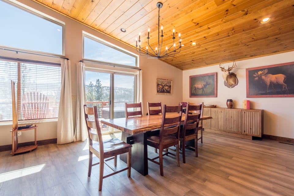 Dining area boasts tons of natural light and lake and mountain views.