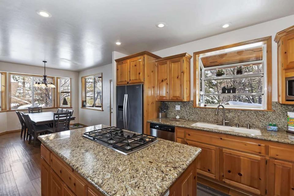 Kitchen features an island and modern appliances.