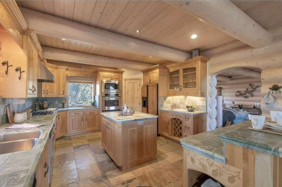 Large kitchen with modern appliances and an island.