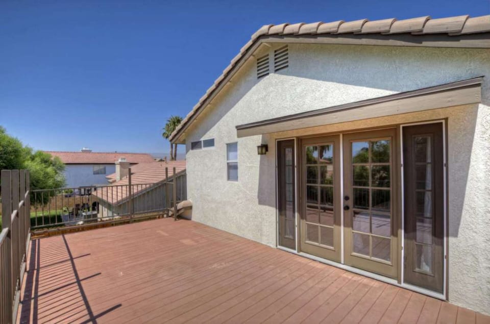 Large private balcony off the primary bedroom.