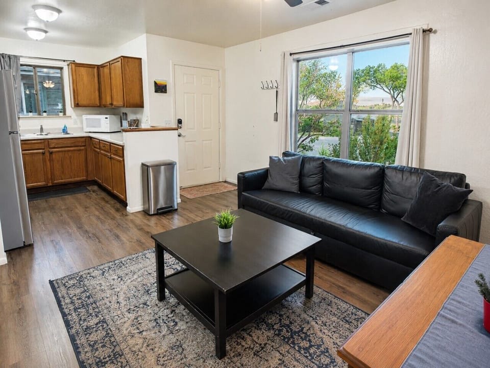 Dining and workspace area with natural light, Wi-Fi, and a comfortable setup for meals, remote work, or planning your Grand Canyon day.