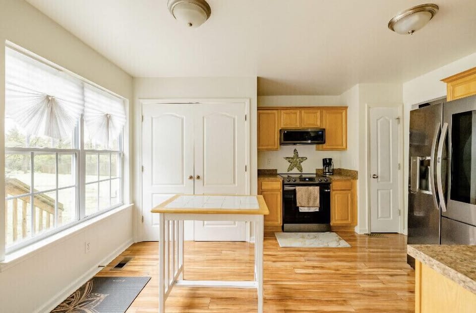 Kitchen, washer and dryer behind double doors