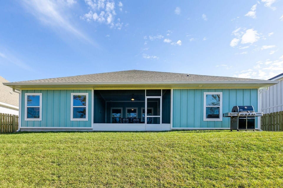 The backyard is perfect for grilling and enjoying the weather with family and friends.